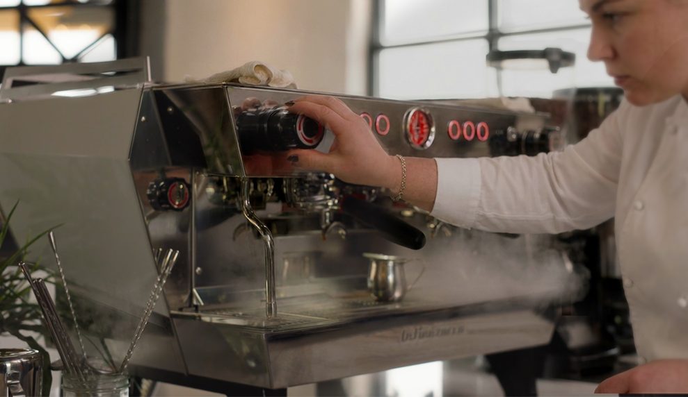 Barista at a La Marzocco espresso bar