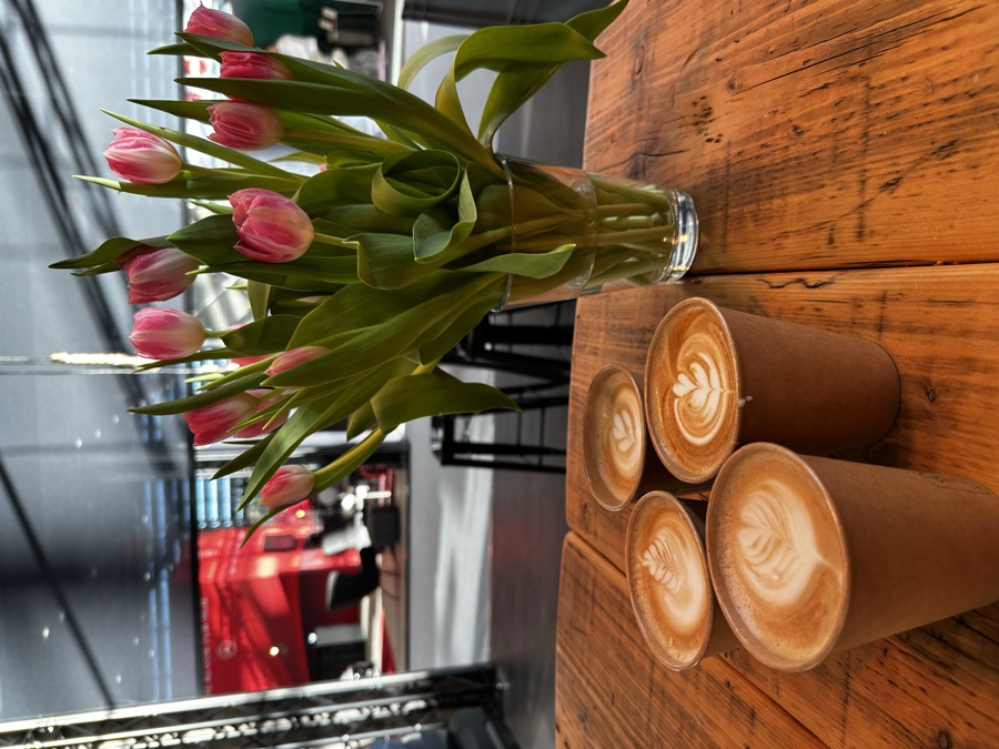 Branded latte art with a logo printed onto the coffee foam